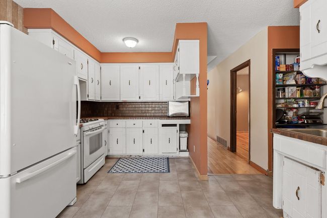 Kitchen with additional pantry storage. Flooring and subflooring were recently replaced. | Image 20