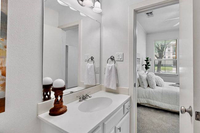 Ensuite bathroom with vanity and a textured wall | Image 32