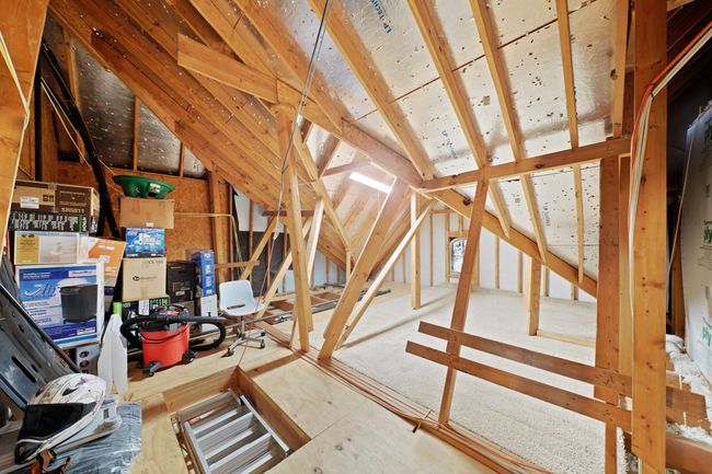 Spacious attic offering ample storage solutions. | Image 36