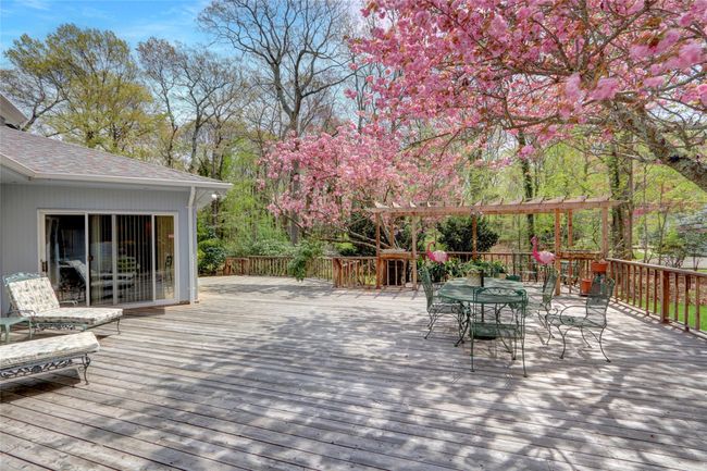 Wooden terrace featuring outdoor dining area | Image 31