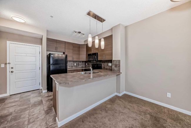 323 - 207 Sunset Drive, Home with 2 bedrooms, 2 bathrooms and 1 parking in Cochrane AB | Image 2
