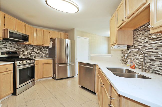 NICELY UPDATED MODERN KITCHEN WITH PLENTY OF CABIN | Image 13
