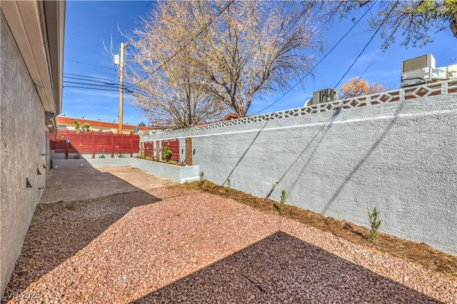 View of yard featuring a patio and fence | Image 36