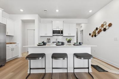 (Photo of decorated model, actual homes colors and finishes will vary) Very spacious kitchen with an abundance of cabinet space | Image 3