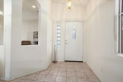 You step inside to neutral tile which flows through all footpaths and into baths. There are glass blocks at entry for light and privacy. | Image 3