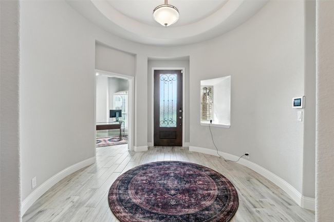 Entryway featuring light wood finished floors and baseboards | Image 6