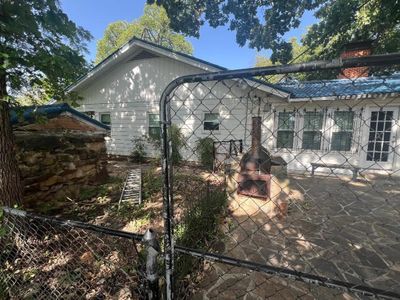 Patio of main home with lots of shade from mature Burr oak tree | Image 3