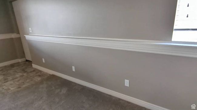 Carpeted empty room featuring baseboards | Image 44