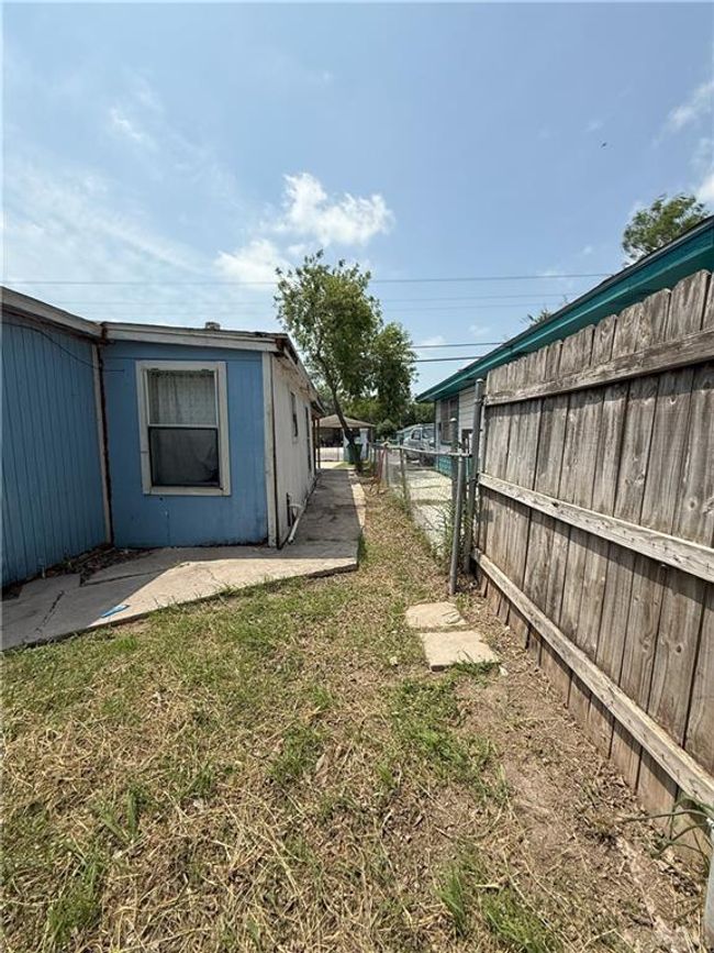View of yard featuring a patio and a fenced backyard | Image 28
