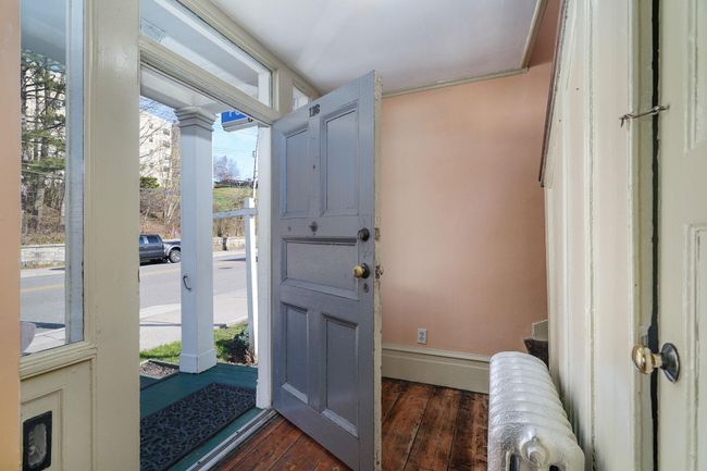 Welcoming entry hall with charm factor, first floor has 3 large room and an additional smaller space. | Image 6