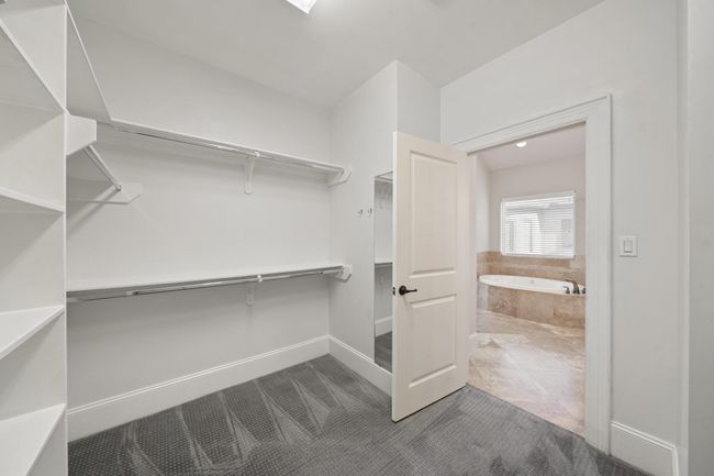 Walk-in primary closet. | Image 20