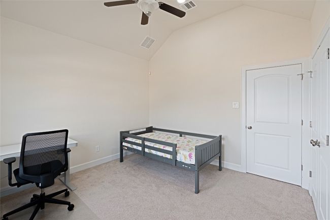 Carpeted office with high vaulted ceiling and ceiling fan | Image 30