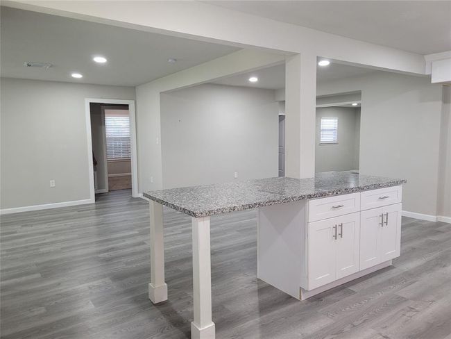 This nice piece of kitchen Island separates the kitchen from the Livingroom and dining room | Image 11