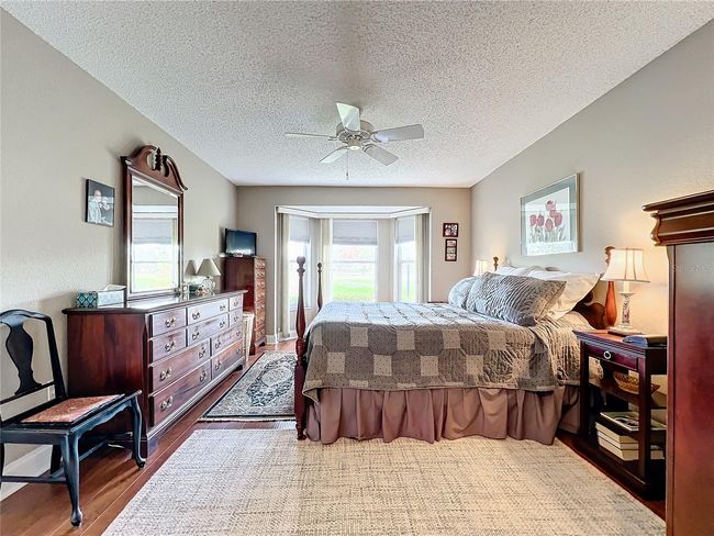 Primary bedroom with view to golf course | Image 27