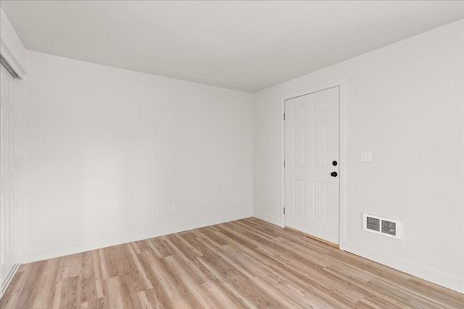 Unfurnished room featuring light wood finished floors and baseboards | Image 5