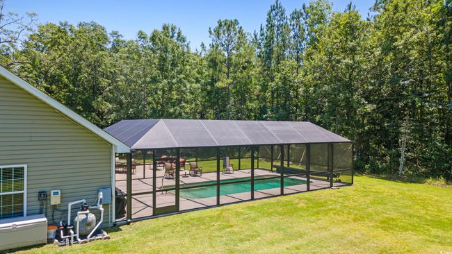 Outdoor pool with a yard, a patio, and a​​‌​​​​‌​​‌‌​‌‌​​​‌‌​​‌‌​‌​​​​​‌ lanai | Image 34