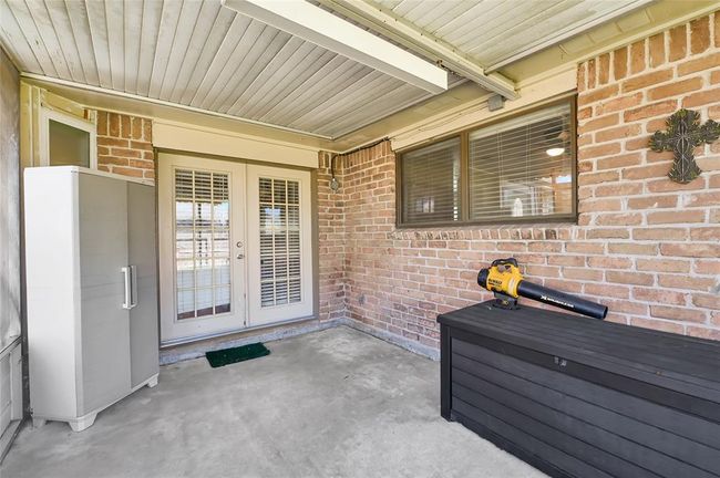 enclosed patio area offering a functional and inviting space for relaxation or storage. | Image 28
