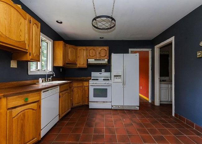 Kitchen featuring sink and white appliances | Image 5
