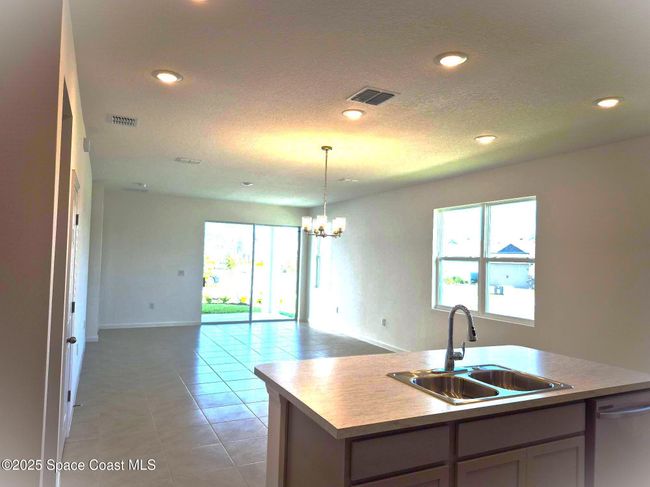 view from kitchen to living room | Image 12