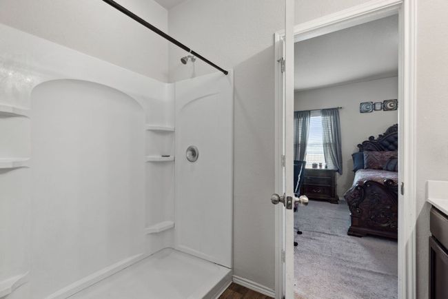 Full bath with a shower, vanity, and ensuite bath | Image 31