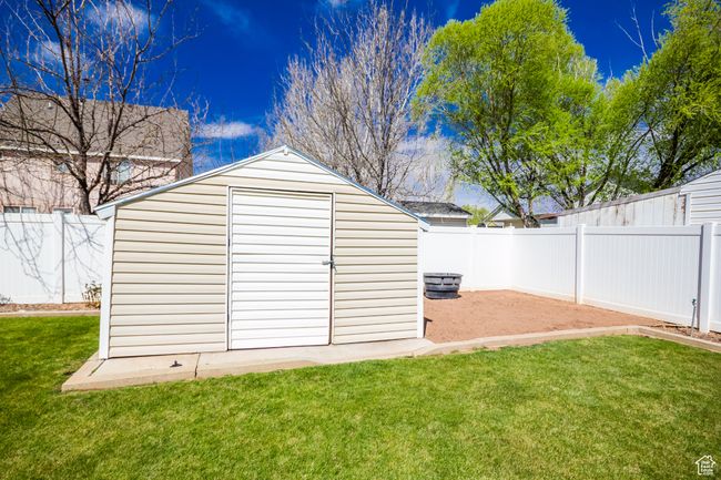 View of shed with a fenced backyard | Image 34