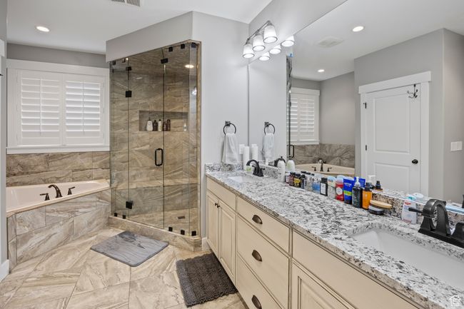 Full bathroom with double vanity, a jetted tub, a steam shower, marble finish flooring, and recessed lighting | Image 32