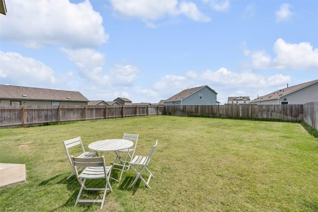 View of fenced backyard | Image 25