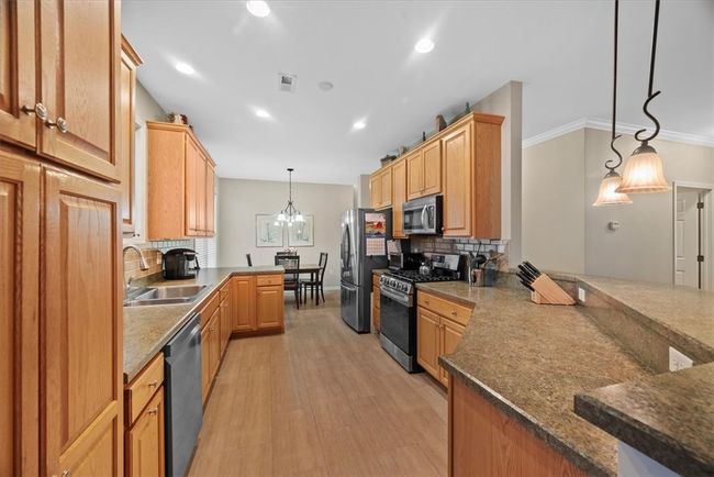 All of the lower level cabinets and pantry cabinet have pull out drawer systems making it easy to store away pots and pans or organize your dry pantry goods. | Image 11