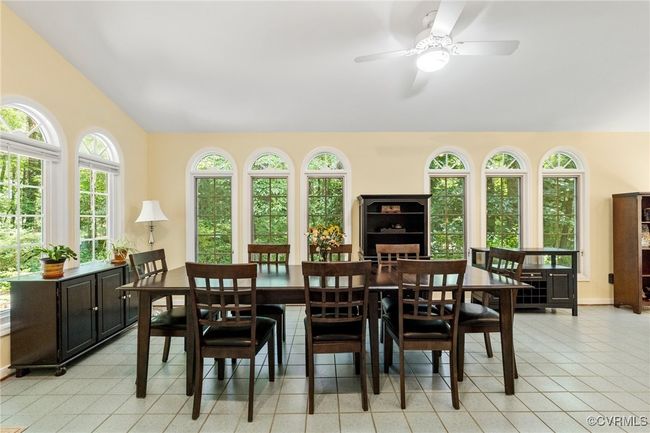 Dining room featuring vaulted ceiling and a ceiling fan | Image 16