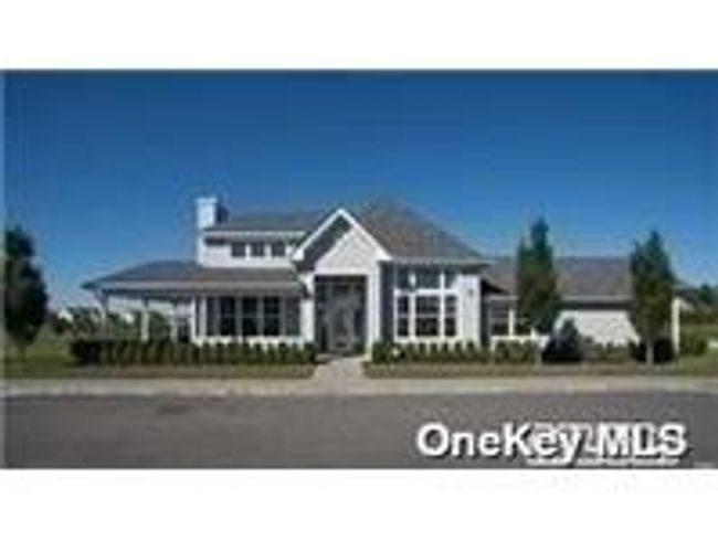 Aerial view of property and surrounding area with a large body of water and nearby suburban area | Image 32