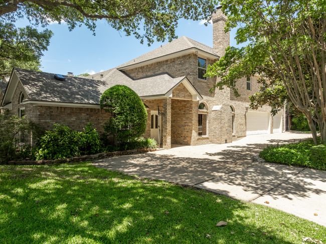 View of side of house featuring entry door and circular driveway | Image 28