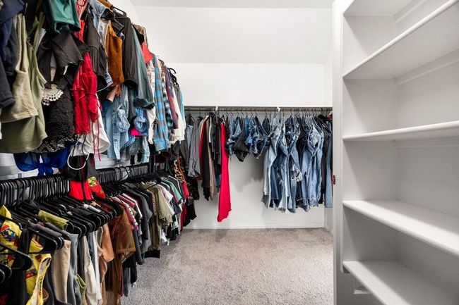 Spacious closet with carpet flooring | Image 25