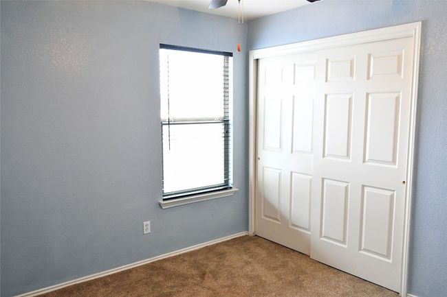 Unfurnished bedroom featuring a closet and carpet flooring | Image 20
