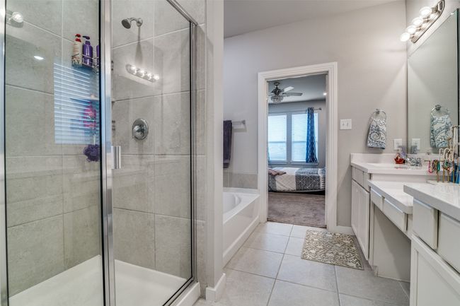 Full bath with vanity, tile patterned floors, a bath, a shower stall, and connected bathroom | Image 17