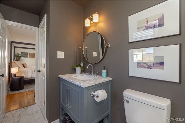 Bathroom with marble finish floor, vanity, and toilet | Image 21