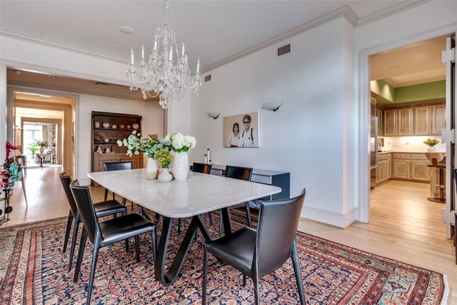 Formal dining room opens to gallery and kitchen. | Image 11