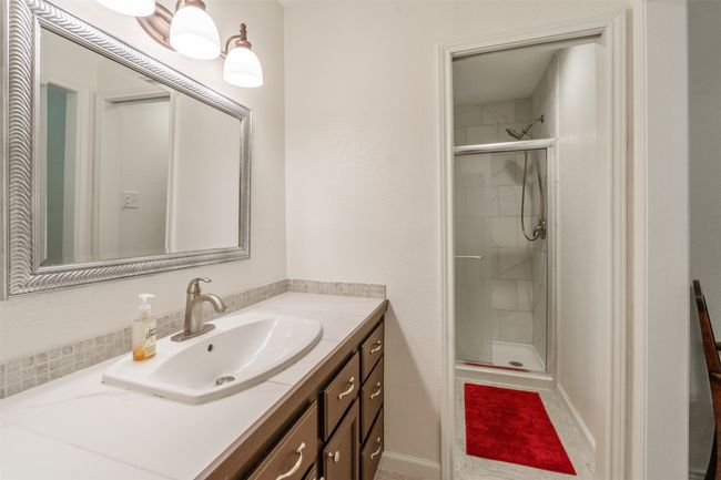 Bathroom featuring vanity and a shower stall | Image 19
