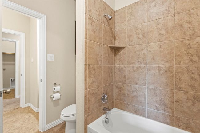 Full bath with shower / bath combination and tile patterned flooring | Image 25