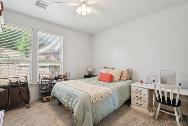 3rd bedroom with wall of windows on main floor | Image 36