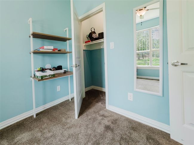 Unfurnished bedroom with carpet flooring and baseboards | Image 35