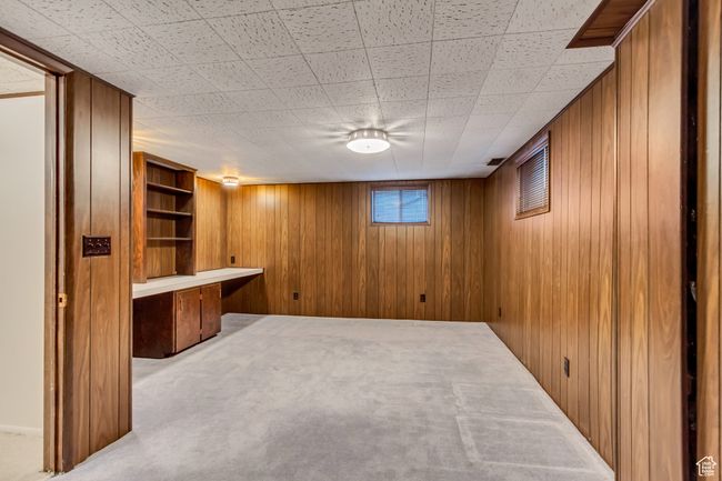 Below grade area with wooden walls and carpet | Image 24