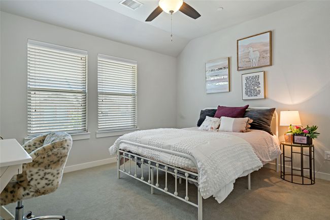 Bedroom with ceiling fan, carpet, and lofted ceiling | Image 16