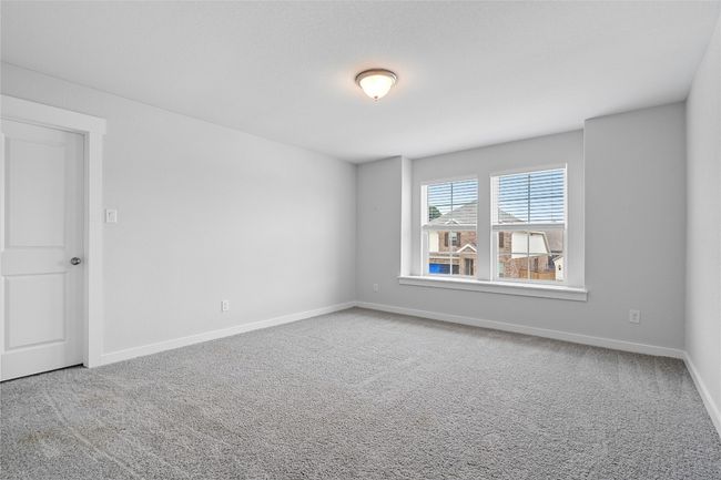 Carpeted empty room featuring baseboards | Image 26