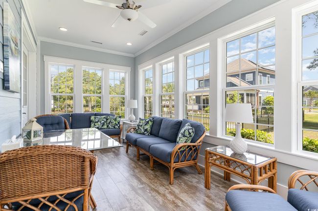 Sunroom / solarium featuring recessed lighting, wood finished floors, visible vents, and ornamental molding | Image 24