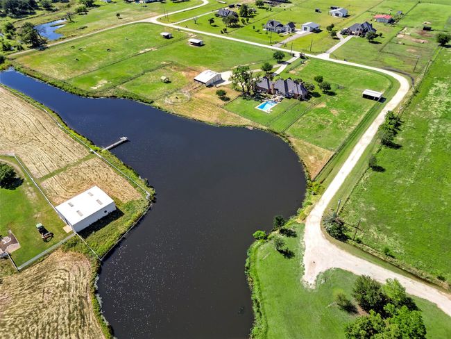 BACK OF PROPERTY AERIAL...Walk Out Your Back Yard And Fish! | Image 4