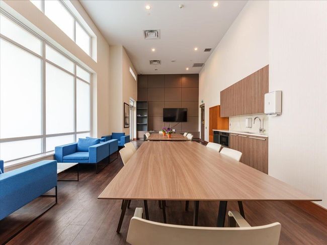 Partyroom with a towering ceiling, dark wood finished floors, and recessed lighting | Image 30