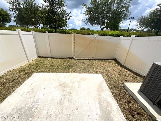 Fenced backyard featuring a patio area and a gate | Image 20