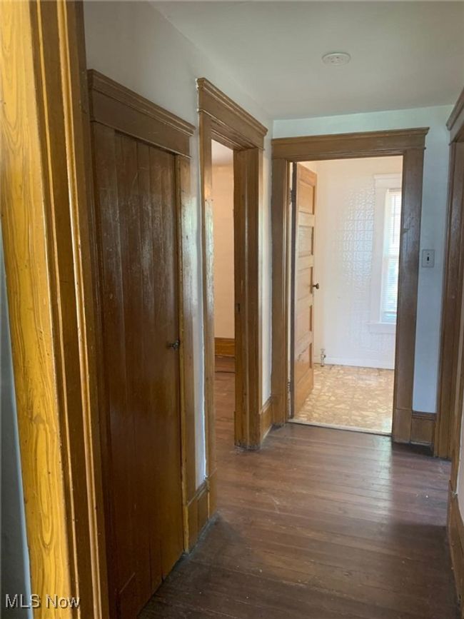 Hall featuring hardwood / wood-style flooring and baseboards | Image 7