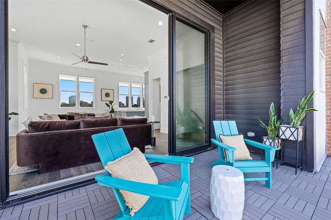 Private balcony off main living area with 10 ft. sliding glass panel doors. Image of model home with similar floorplan. | Image 24