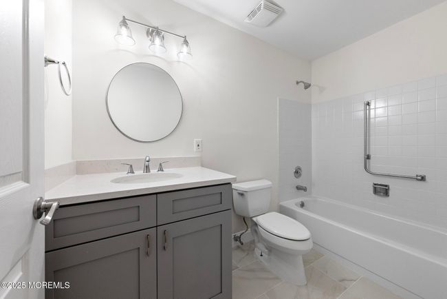 New guest bathroom with tub and shower | Image 20